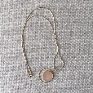 Gold necklace with pink stone pendant
